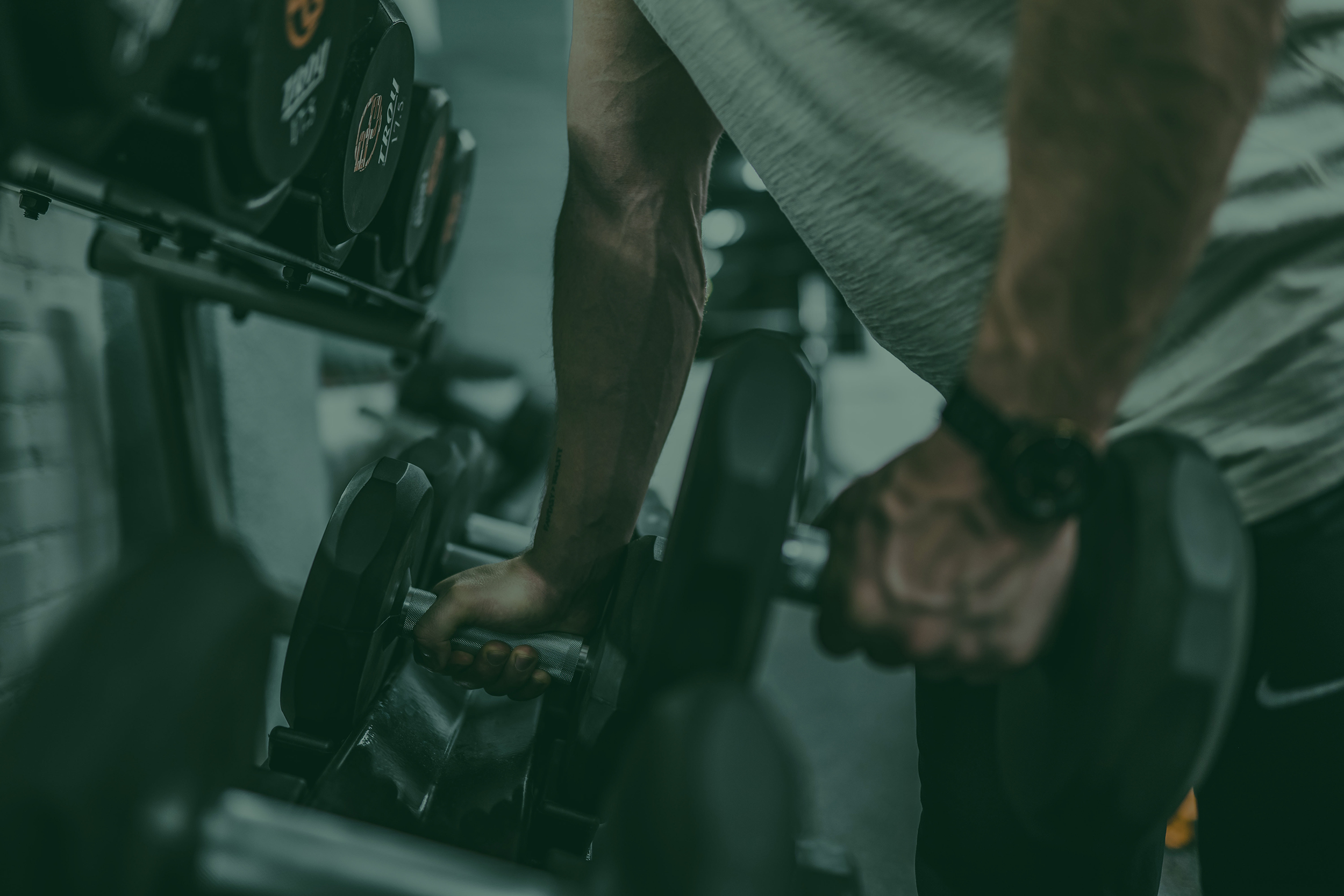 man grabbing weights